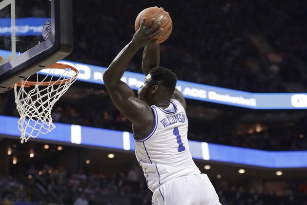 Duke's Zion Williamson (1) goes up to dunk against Syracuse during the first half of an NCAA college basketball game in the Atlantic Coast Conference tournament in Charlotte, N.C., Thursday, March 14, 2019. (AP Photo/Nell Redmond)