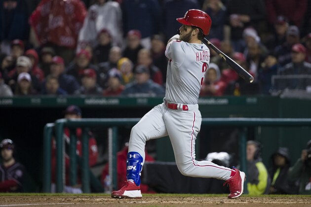 Philadelphia Phillies' Bryce Harper watches his double during the fifth inning of a baseball game against the Washington Nationals at Nationals Park, Tuesday, April 2, 2019, in Washington. (AP Photo/Alex Brandon)