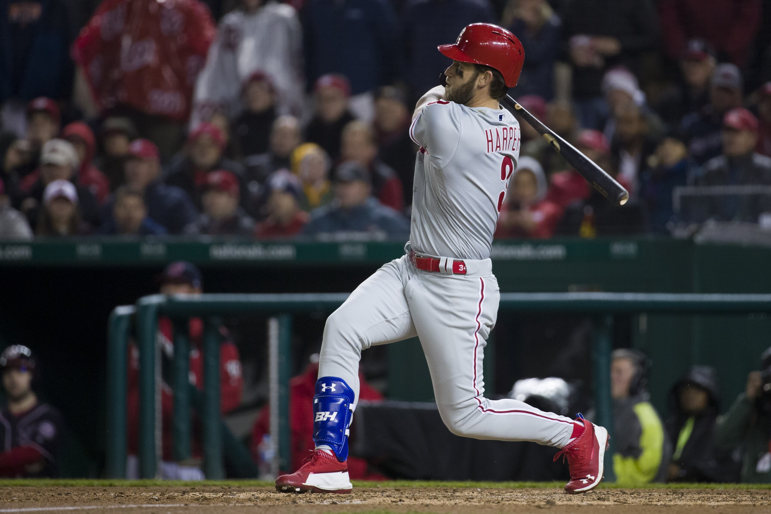 Philadelphia Phillies' Bryce Harper watches his double during the fifth inning of a baseball game against the Washington Nationals at Nationals Park, Tuesday, April 2, 2019, in Washington. (AP Photo/Alex Brandon)