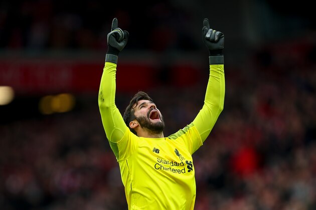 LIVERPOOL, ENGLAND - MARCH 31:  Alisson Becker of Liverpool celebrates the first goal during the Premier League match between Liverpool FC and Tottenham Hotspur at Anfield on March 31, 2019 in Liverpool, United Kingdom. (Photo by Robbie Jay Barratt - AMA/Getty Images)