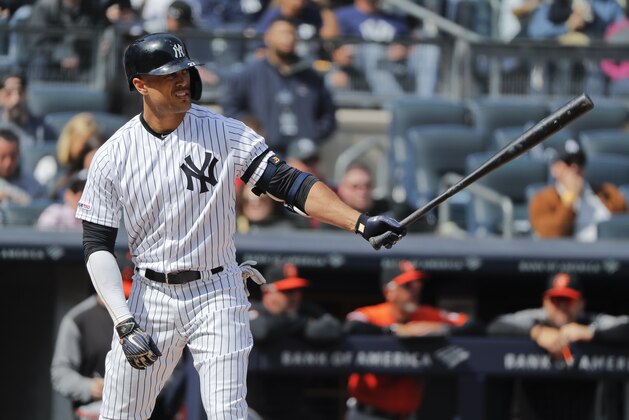 New York Yankees right fielder Giancarlo Stanton waits for the pitch against the Baltimore Orioles during the fourth inning of a baseball game, Saturday, March 30, 2019, in New York. (AP Photo/Julie Jacobson)