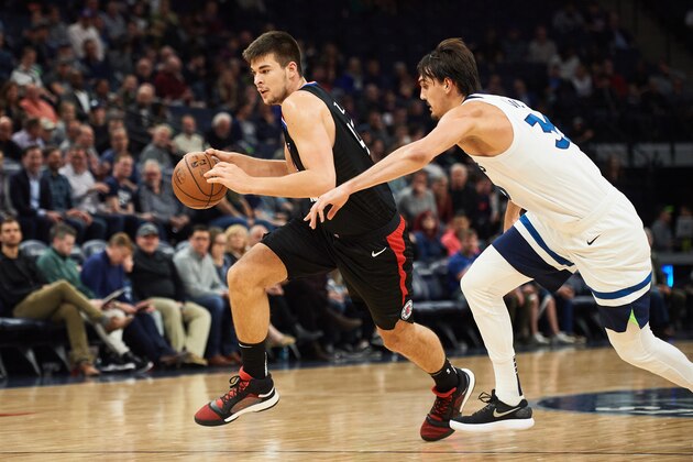 MINNEAPOLIS, MN - MARCH 26: Ivica Zubac #40 of the LA Clippers drives to the basket against Dario Saric #36 of the Minnesota Timberwolves during the game on March 26, 2019 at the Target Center in Minneapolis, Minnesota. NOTE TO USER: User expressly acknowledges and agrees that, by downloading and or using this Photograph, user is consenting to the terms and conditions of the Getty Images License Agreement. (Photo by Hannah Foslien/Getty Images)