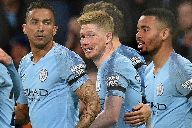 Manchester City's Belgian midfielder Kevin De Bruyne (C) celebrates scoring the opening goal during the English Premier League football match between Manchester City and Cardiff City at the Etihad Stadium in Manchester, north west England, on April 3, 2019. (Photo by Oli SCARFF / AFP) / RESTRICTED TO EDITORIAL USE. No use with unauthorized audio, video, data, fixture lists, club/league logos or 'live' services. Online in-match use limited to 120 images. An additional 40 images may be used in extra time. No video emulation. Social media in-match use limited to 120 images. An additional 40 images may be used in extra time. No use in betting publications, games or single club/league/player publications. /         (Photo credit should read OLI SCARFF/AFP/Getty Images)