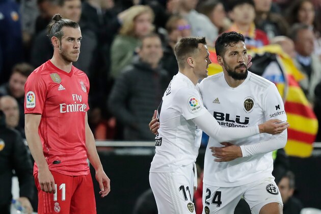 VALENCIA, SPAIN - APRIL 3: Ezequiel Garay of Valencia CF Celebrates 2-0 Denis Cheryshev of Valencia CF  during the La Liga Santander  match between Valencia v Real Madrid at the Estadio de Mestalla on April 3, 2019 in Valencia Spain (Photo by Jeroen Meuwsen/Soccrates/Getty Images)