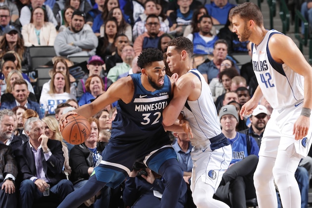 DALLAS, TX - APRIL 3: Karl-Anthony Towns #32 of the Minnesota Timberwolves jocks for a position during the game against Dwight Powell #7 of the Dallas Mavericks on April 3, 2019 at the American Airlines Center in Dallas, Texas. NOTE TO USER: User expressly acknowledges and agrees that, by downloading and or using this photograph, User is consenting to the terms and conditions of the Getty Images License Agreement. Mandatory Copyright Notice: Copyright 2019 NBAE (Photo by Glenn James/NBAE via Getty Images)