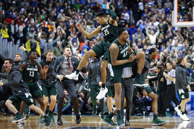 WASHINGTON, DC - MARCH 31: Nick Ward #44 and Kenny Goins #25 of the Michigan State Spartans celebrate their teams 68-67 win over the Duke Blue Devils in the East Regional game of the 2019 NCAA Men's Basketball Tournament at Capital One Arena on March 31, 2019 in Washington, DC. (Photo by Patrick Smith/Getty Images)