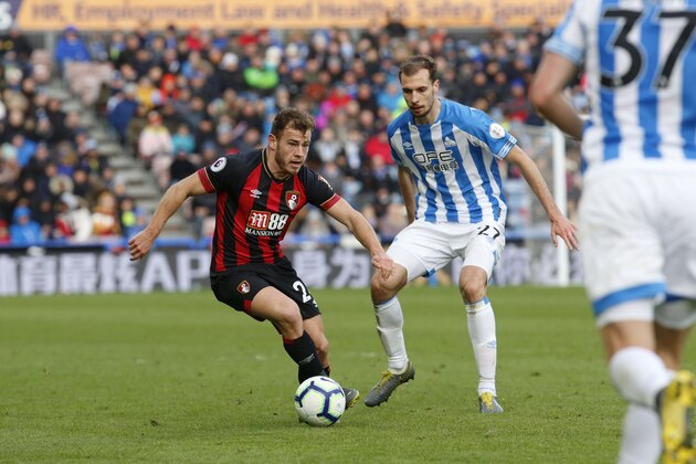 HUDDERSFIELD, ENGLAND - MARCH 09: Ryan Fraser shields the ball from Jon Gorenc Stankovic of Huddersfield Town during the Premier League match between Huddersfield Town and AFC Bournemouth at John Smith's Stadium on March 09, 2019 in Huddersfield, United Kingdom. (Photo by John Early/Getty Images)