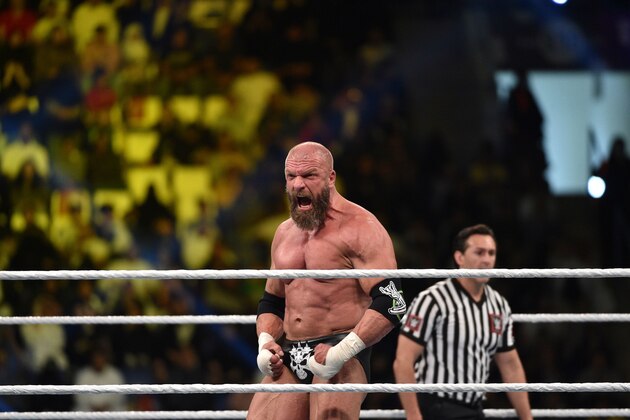 Triple H reacts during a tag team match as part of as part of the World Wrestling Entertainment (WWE) Crown Jewel pay-per-view at the King Saud University Stadium in Riyadh on November 2, 2018. (Photo by Fayez Nureldine / AFP)        (Photo credit should read FAYEZ NURELDINE/AFP/Getty Images)