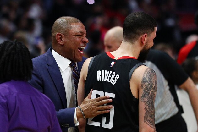 LOS ANGELES, CALIFORNIA - APRIL 03: Doc Rivers of the Los Angeles Clippers speaks to Austin Rivers #25 of the Houston Rockets following their loss at Staples Center on April 03, 2019 in Los Angeles, California. NOTE TO USER: User expressly acknowledges and agrees that, by downloading and or using this photograph, User is consenting to the terms and conditions of the Getty Images License Agreement. (Photo by Yong Teck Lim/Getty Images)