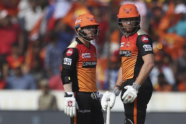Sunrisers Hyderabad's David Warner, left, and Jonny Bairstow talk between the wickets against Royal Challengers Bangalore during the VIVO IPL T20 cricket match in Hyderabad, India, Sunday, March 31, 2019. (AP Photo/ Mahesh Kumar A.)