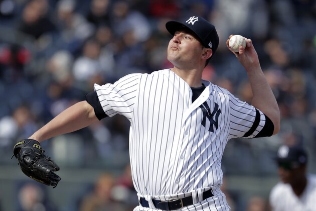 New York Yankees relief pitcher Zack Britton throws a pitch during the eighth inning of an opening day baseball game against the Baltimore Orioles at Yankee Stadium, Thursday, March 28, 2019, in New York. The Yankees won 7-2. (AP Photo/Julio Cortez)