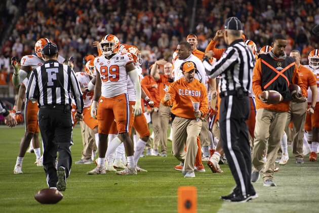 SANTA CLARA, CA - JANUARY 07: Head Coach Dabo Swinney of the Clemson Tigers and his team celebrate a defensive stop against the Alabama Crimson Tide during the College Football Playoff National Championship held at Levi's Stadium on January 7, 2019 in Santa Clara, California. The Clemson Tigers defeated the Alabama Crimson Tide 44-16. (Photo by Jamie Schwaberow/Getty Images)