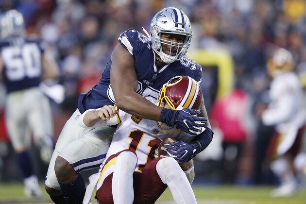 LANDOVER, MD - OCTOBER 21: David Irving #95 of the Dallas Cowboys sacks Alex Smith #11 of the Washington Redskins during the game at FedExField on October 21, 2018 in Landover, Maryland. The Redskins won 20-17. (Photo by Joe Robbins/Getty Images)