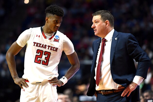 TULSA, OKLAHOMA - MARCH 24:  Jarrett Culver #23 of the Texas Tech Red Raiders speaks with head coach Chris Beard during the second half of the second round game of the 2019 NCAA Men's Basketball Tournament against the Buffalo Bulls at BOK Center on March 24, 2019 in Tulsa, Oklahoma. (Photo by Stacy Revere/Getty Images)