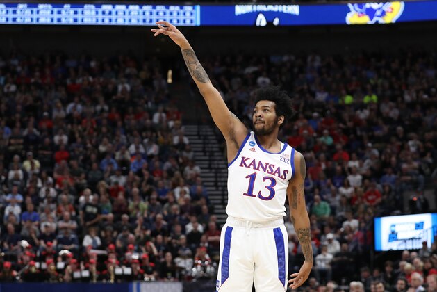 SALT LAKE CITY, UTAH - MARCH 21: K.J. Lawson #13 of the Kansas Jayhawks gestures during the second half against the Northeastern Huskies in the first round of the 2019 NCAA Men's Basketball Tournament at Vivint Smart Home Arena on March 21, 2019 in Salt Lake City, Utah. (Photo by Patrick Smith/Getty Images)