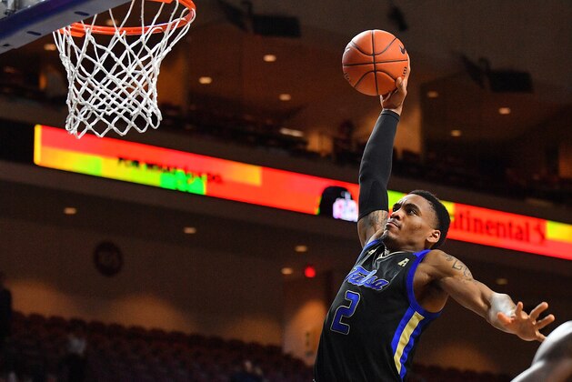 LAS VEGAS, NEVADA - NOVEMBER 22:  DaQuan Jeffries #2 of the Tulsa Golden Hurricane dunks against the Nevada Wolf Pack during the 2018 Continental Tire Las Vegas Holiday Invitational basketball tournament at the Orleans Arena on November 22, 2018 in Las Vegas, Nevada. Nevada defeated Tulsa 96-86.  (Photo by Sam Wasson/Getty Images)