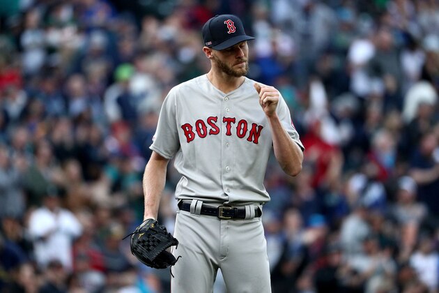 SEATTLE, WA - MARCH 28: Chris Sale #41 of the Boston Red Sox reacts after giving up a solo home run to Edwin Encarnacion #10 of the Seattle Mariners in the third inning during their Opening Day game at T-Mobile Park on March 28, 2019 in Seattle, Washington.  (Photo by Abbie Parr/Getty Images)