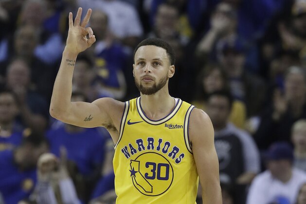 Golden State Warriors guard Stephen Curry (30) gestures after making a 3-point basket against the Denver Nuggets during the first half of an NBA basketball game in Oakland, Calif., Tuesday, April 2, 2019. (AP Photo/Jeff Chiu)
