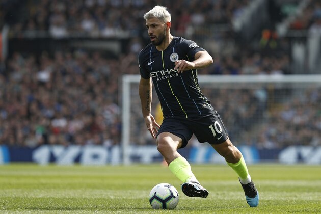 Manchester City's Argentinian striker Sergio Aguero runs with the ball during the English Premier League football match between Fulham and Manchester City at Craven Cottage in London on March 30, 2019. (Photo by Adrian DENNIS / AFP) / RESTRICTED TO EDITORIAL USE. No use with unauthorized audio, video, data, fixture lists, club/league logos or 'live' services. Online in-match use limited to 120 images. An additional 40 images may be used in extra time. No video emulation. Social media in-match use limited to 120 images. An additional 40 images may be used in extra time. No use in betting publications, games or single club/league/player publications. /         (Photo credit should read ADRIAN DENNIS/AFP/Getty Images)