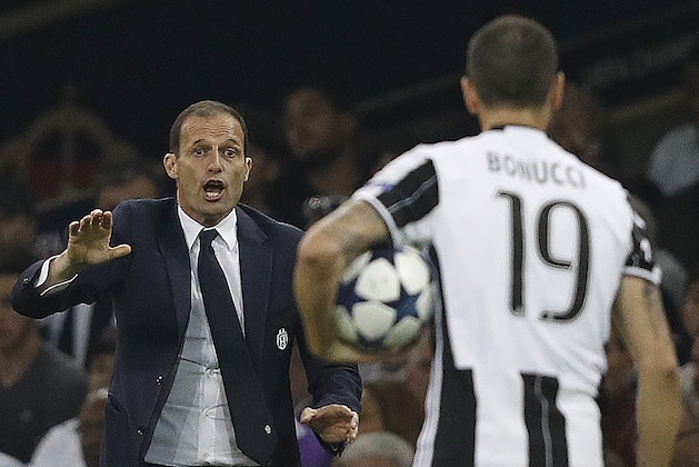 Juventus' manager Massimiliano Allegri (L) gestures to Juventus' Italian defender Leonardo Bonucci during the UEFA Champions League final football match between Juventus and Real Madrid at The Principality Stadium in Cardiff, south Wales, on June 3, 2017. / AFP PHOTO / Adrian DENNIS        (Photo credit should read ADRIAN DENNIS/AFP/Getty Images)