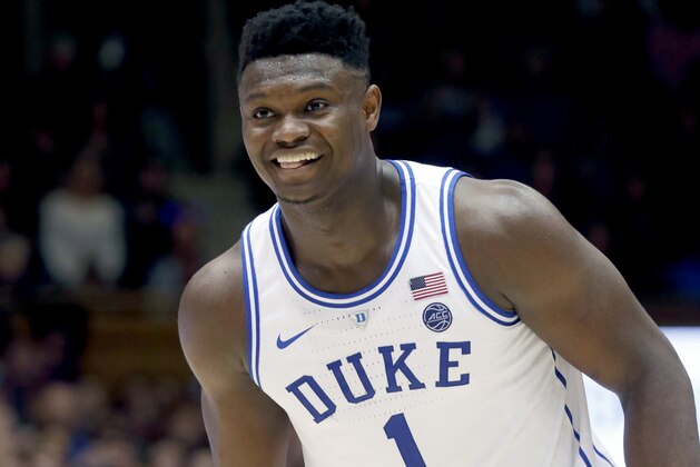 Duke's Zion Williamson (1) flashes a grin after his team made a play against North Carolina State during the second half of an NCAA college basketball game in Durham, N.C., Saturday, Feb. 16, 2019. (AP Photo/Chris Seward)