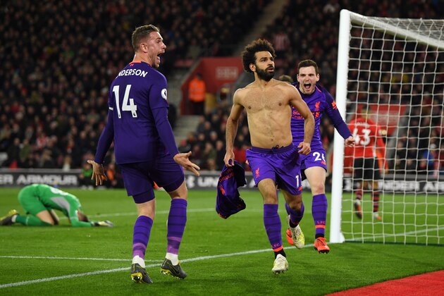 SOUTHAMPTON, ENGLAND - APRIL 05: Mohamed Salah of Liverpool celebrates with team mates Andy Robertson of Liverpool and Jordan Henderson of Liverpool after scoring their team's second goal during the Premier League match between Southampton FC and Liverpool FC at St Mary's Stadium on April 05, 2019 in Southampton, United Kingdom. (Photo by Mike Hewitt/Getty Images)