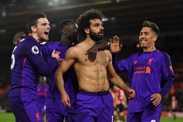 SOUTHAMPTON, ENGLAND - APRIL 05: Mohamed Salah of Liverpool celebrates with team mates Roberto Firmino of Liverpool and Andy Robertson of Liverpool after scoring their team's second goal during the Premier League match between Southampton FC and Liverpool FC at St Mary's Stadium on April 05, 2019 in Southampton, United Kingdom. (Photo by Mike Hewitt/Getty Images)