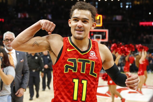 Atlanta Hawks guard Trae Young (11) reacts after the Hawks won in overtime of an NBA basketball game against the Milwaukee Bucks, Sunday, March 31, 2019, in Atlanta. (AP Photo/Todd Kirkland)