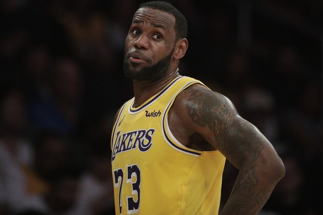 Los Angeles Lakers' LeBron James talks to his teammate during the second half of an NBA basketball game against the Washington Wizards, Tuesday, March 26, 2019, in Los Angeles. The Lakers won 124-106. (AP Photo/Jae C. Hong)