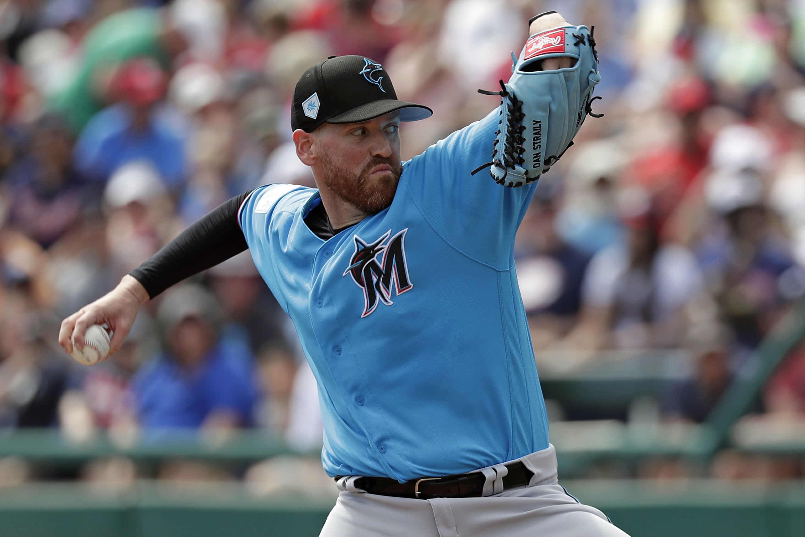 Miami Marlins pitcher Dan Straily throws against the Atlanta Braves in the first inning of a spring baseball exhibition game, Sunday, March 3, 2019, in Kissimmee, Fla. (AP Photo/John Raoux)