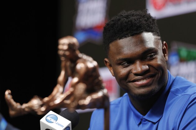 Duke freshman Zion Williamson sits behind the Oscar Robertson Trophy at a news conference where he was awarded the U.S. Basketball Writers Association College Player of the Year award at the Final Four NCAA college basketball tournament, Friday, April 5, 2019, in Minneapolis. (AP Photo/Charlie Neibergall)