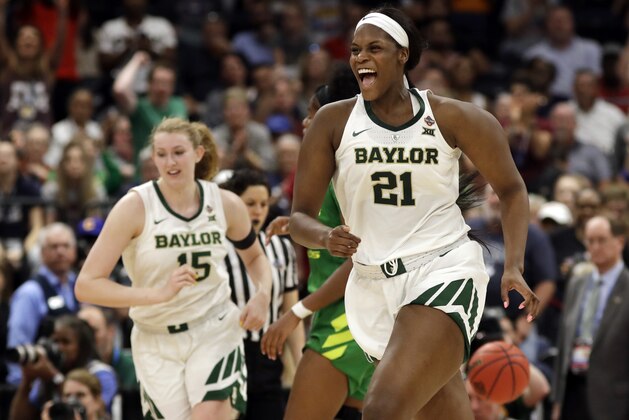 Baylor center Kalani Brown (21) and forward Lauren Cox (15) celebrate after defeating Oregon in a women's Final Four NCAA college basketball semifinal tournament game Friday, April 5, 2019, in Tampa, Fla. (AP Photo/Chris O'Meara)