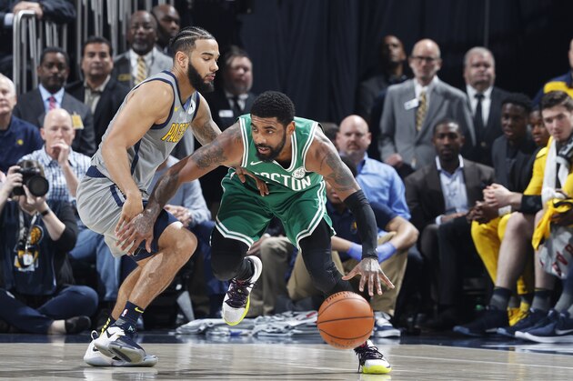 INDIANAPOLIS, IN - APRIL 05: Kyrie Irving #11 of the Boston Celtics handles the ball against Cory Joseph #6 of the Indiana Pacers in the first half of a game at Bankers Life Fieldhouse on April 5, 2019 in Indianapolis, Indiana. NOTE TO USER: User expressly acknowledges and agrees that, by downloading and or using the photograph, User is consenting to the terms and conditions of the Getty Images License Agreement. (Photo by Joe Robbins/Getty Images)