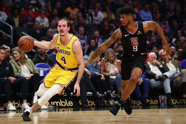 LOS ANGELES, CALIFORNIA - APRIL 05: Alex Caruso #4 of the Los Angeles Lakers drives against Tyrone Wallace #9 of the Los Angeles Clippers during the first half at Staples Center on April 05, 2019 in Los Angeles, California. NOTE TO USER: User expressly acknowledges and agrees that, by downloading and or using this photograph, User is consenting to the terms and conditions of the Getty Images License Agreement. (Photo by Yong Teck Lim/Getty Images)