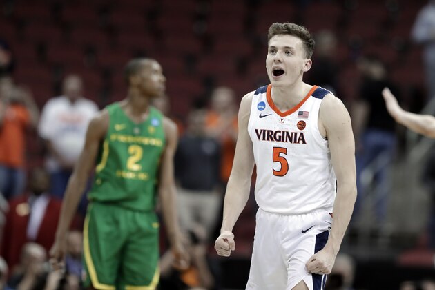 Virginia's Kyle Guy celebrates following a men's NCAA Tournament college basketball South Regional semifinal game against Oregon, Friday, March 29, 2019, in Louisville, Ky. Virginia won 53-49. (AP Photo/Michael Conroy)