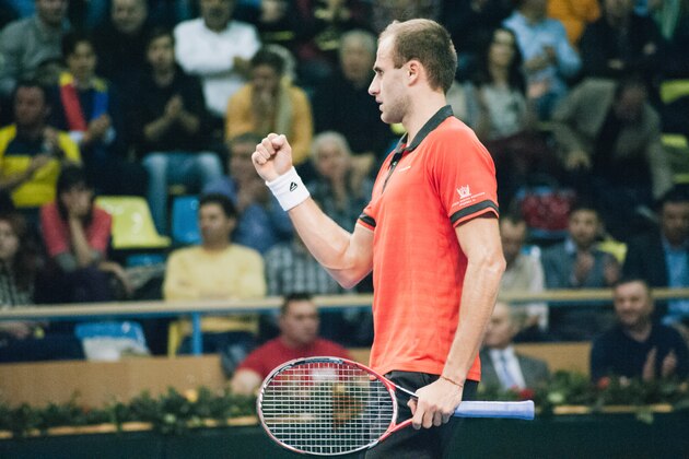 Marius Copil of Romania enjoys his victory over  Blaz Rola of Slovenia during day 1 of the Davis Cup World Group first round tie between Romania and Slovenia, on March 4, 2016 in Arad, Romania. (Photo by Ciprian Hord/The Everyday Projects/Getty Images)