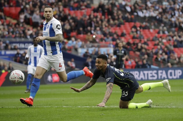 Manchester City's Gabriel Jesus scores the opening goal during the English FA Cup semifinal soccer match between Manchester City and Brighton & Hove Albion at Wembley Stadium in London, Saturday, April 6, 2019. (AP Photo/Matt Dunham)