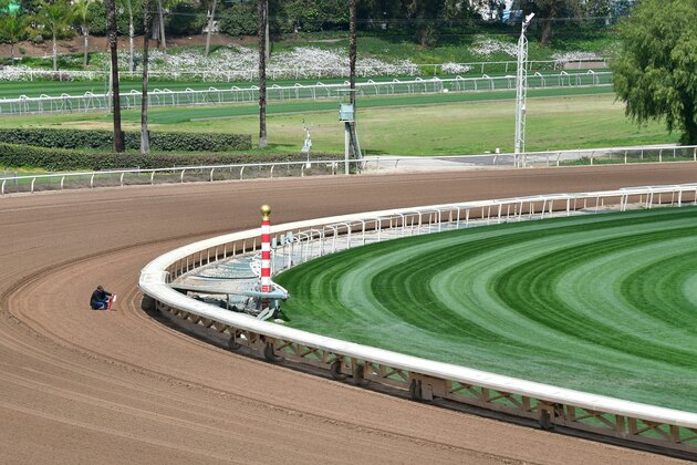 Samples and measurements are taken on the sand track at Santa Anita Racetrack in Arcadia, California on March 7, 2019, where races have been suspended indefinitely and inspections launched in response to a recent spate of horse deaths, twenty one in total since December 26, 2018. - A winter of rain in the area has led to an increase of water on the tracks, and additional testing of the track is needed to ensure  consistency and uniformity for both training and racing, according to Santa Anita officials. (Photo by Frederic J. BROWN / AFP)        (Photo credit should read FREDERIC J. BROWN/AFP/Getty Images)