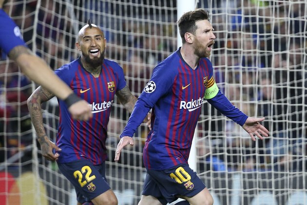 BARCELONA, SPAIN - MARCH 13: Lionel Messi of Barcelona celebrates his second goal with Arturo Vidal during the UEFA Champions League Round of 16 Second Leg match between FC Barcelona and Olympique Lyonnais (OL, Lyon) at Camp Nou stadium on March 13, 2019 in Barcelona, Spain. (Photo by Jean Catuffe/Getty Images)