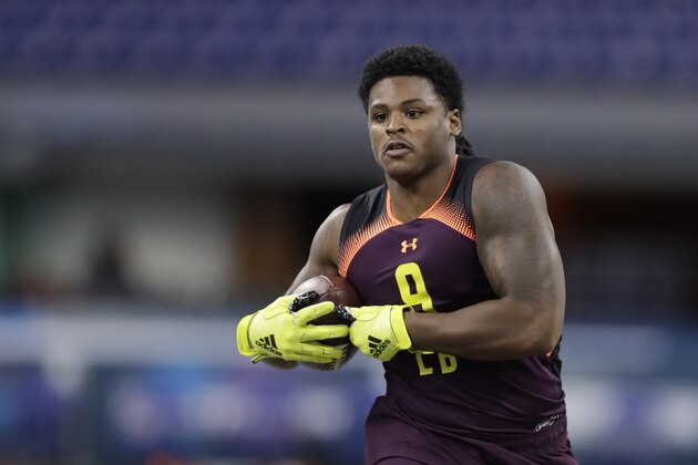 Michigan linebacker Devin Bush runs a drill during the NFL football scouting combine, Sunday, March 3, 2019, in Indianapolis. (AP Photo/Darron Cummings)