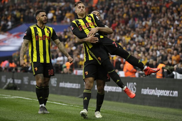 Watford's Gerard Deulofeu, front right, celebrates with teammates after scoring his side's third goal during the English FA Cup semifinal soccer match between Watford and Wolverhampton Wanderers at Wembley Stadium in London, Sunday, April 7, 2019. (AP Photo/Matt Dunham)