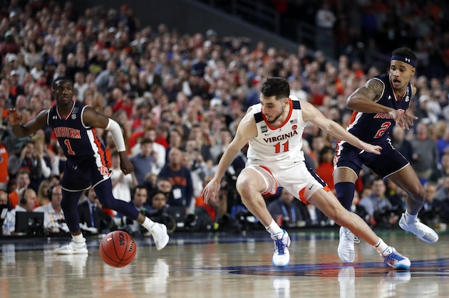 Virginia guard Ty Jerome (11) runs down a loose ball ahead of Auburn guard Bryce Brown, right, during the second half in the semifinals of the Final Four NCAA college basketball tournament, Saturday, April 6, 2019, in Minneapolis. (AP Photo/Jeff Roberson)