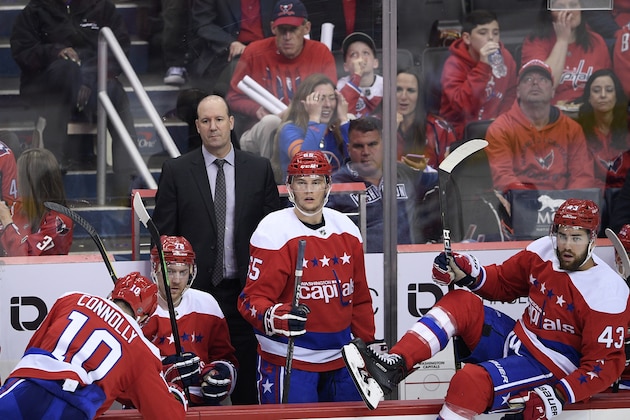 Washington Capitals head coach Todd Reirden, top left, watches during the third period of an NHL hockey game against the New York Islanders, Saturday, April 6, 2019, in Washington. The Islanders won 3-0. (AP Photo/Nick Wass)