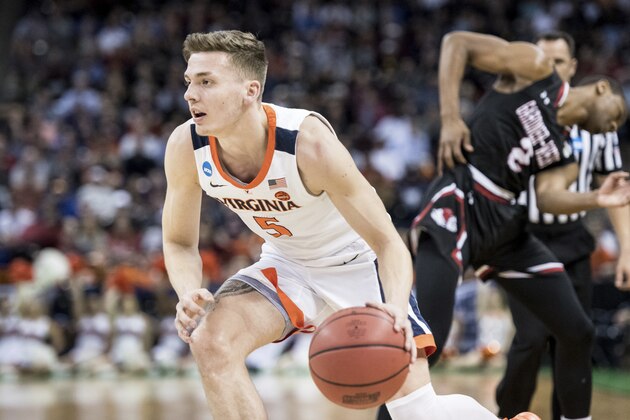 Virginia guard Kyle Guy (5) dribbles the ball against Gardner Webb during the first half of a first-round game in the NCAA men's college basketball tournament Friday, March 22, 2019, in Columbia, S.C. Virginia defeated Gardner-Webb 71-56. (AP Photo/Sean Rayford)