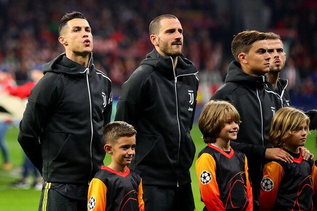 MADRID, SPAIN - FEBRUARY 20: (l-r) Cristiano Ronaldo, Leonardo Bonucci and Paulo Dybala of Juventus line up ahead of the UEFA Champions League Round of 16 First Leg match between Club Atletico de Madrid and Juventus at Estadio Wanda Metropolitano on February 20, 2019 in Madrid, Spain. (Photo by Chris Brunskill/Fantasista/Getty Images)