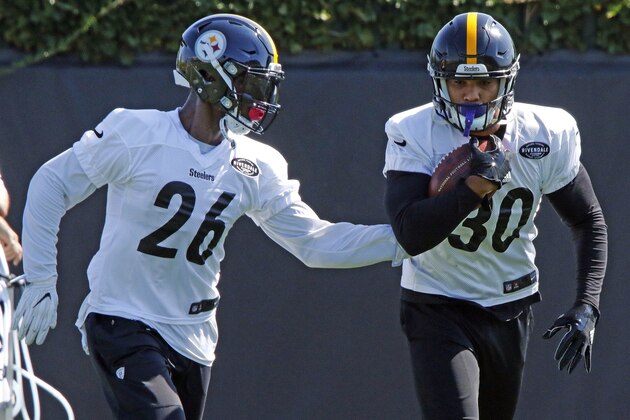 Pittsburgh Steelers running backs Le'Veon Bell (26) and James Conner run a drill during a team practice at the NFL football team's training facility in Pittsburgh, on Monday, Sept. 4, 2017. It was Bell's first workout with the team. (AP Photo/Gene J. Puskar)