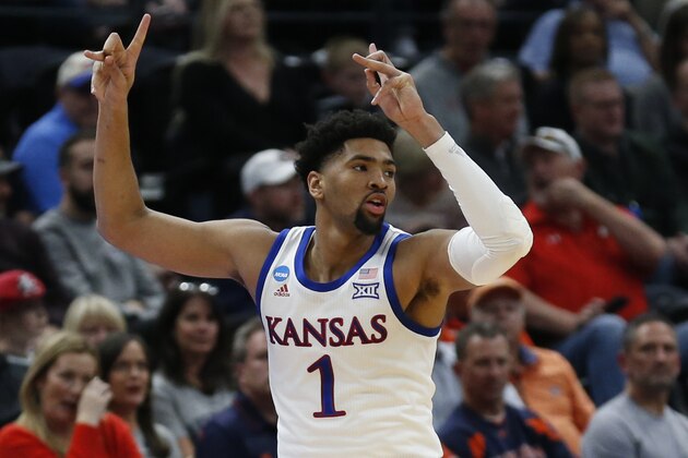 Kansas forward Dedric Lawson (1) celebrates after scoring a three-point basket against Northeastern in the first half during a first round men's college basketball game in the NCAA Tournament, Thursday, March 21, 2019, in Salt Lake City. (AP Photo/Rick Bowmer)