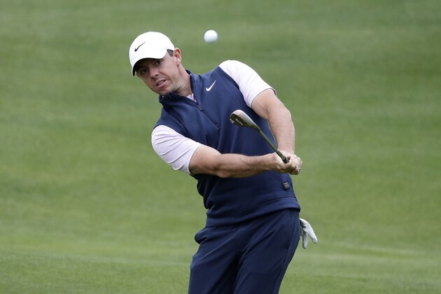 Rory McIlroy chips to the green on the fifth hole during round-robin play at the Dell Technologies Match Play Championship golf tournament, Friday, March 29, 2019, in Austin, Texas. (AP Photo/Eric Gay)