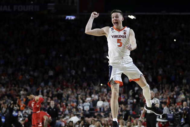 Virginia's Kyle Guy (5) celebrates after defeating Texas Tech 85-77 in the overtime in the championship of the Final Four NCAA college basketball tournament, Monday, April 8, 2019, in Minneapolis. (AP Photo/David J. Phillip)