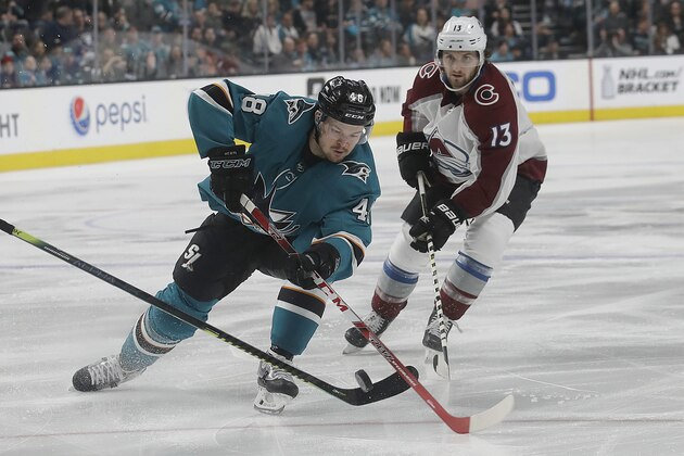 San Jose Sharks center Tomas Hertl (48) skates in front of Colorado Avalanche center Alexander Kerfoot (13) during the first period of an NHL hockey game in San Jose, Calif., Saturday, April 6, 2019. (AP Photo/Jeff Chiu)